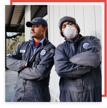 two workers standing side by side