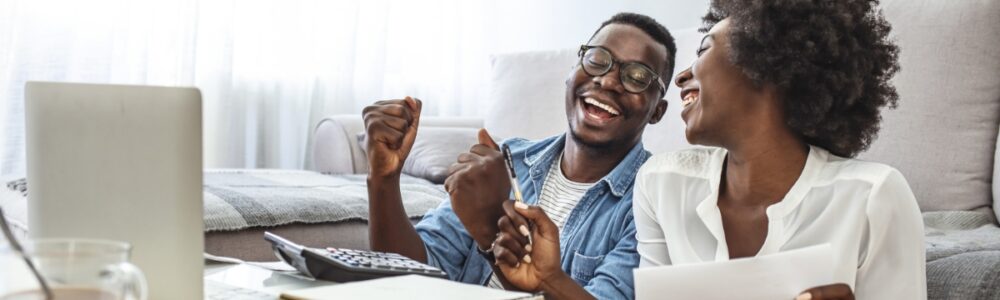 Couple celebrating that they got financing through greensky